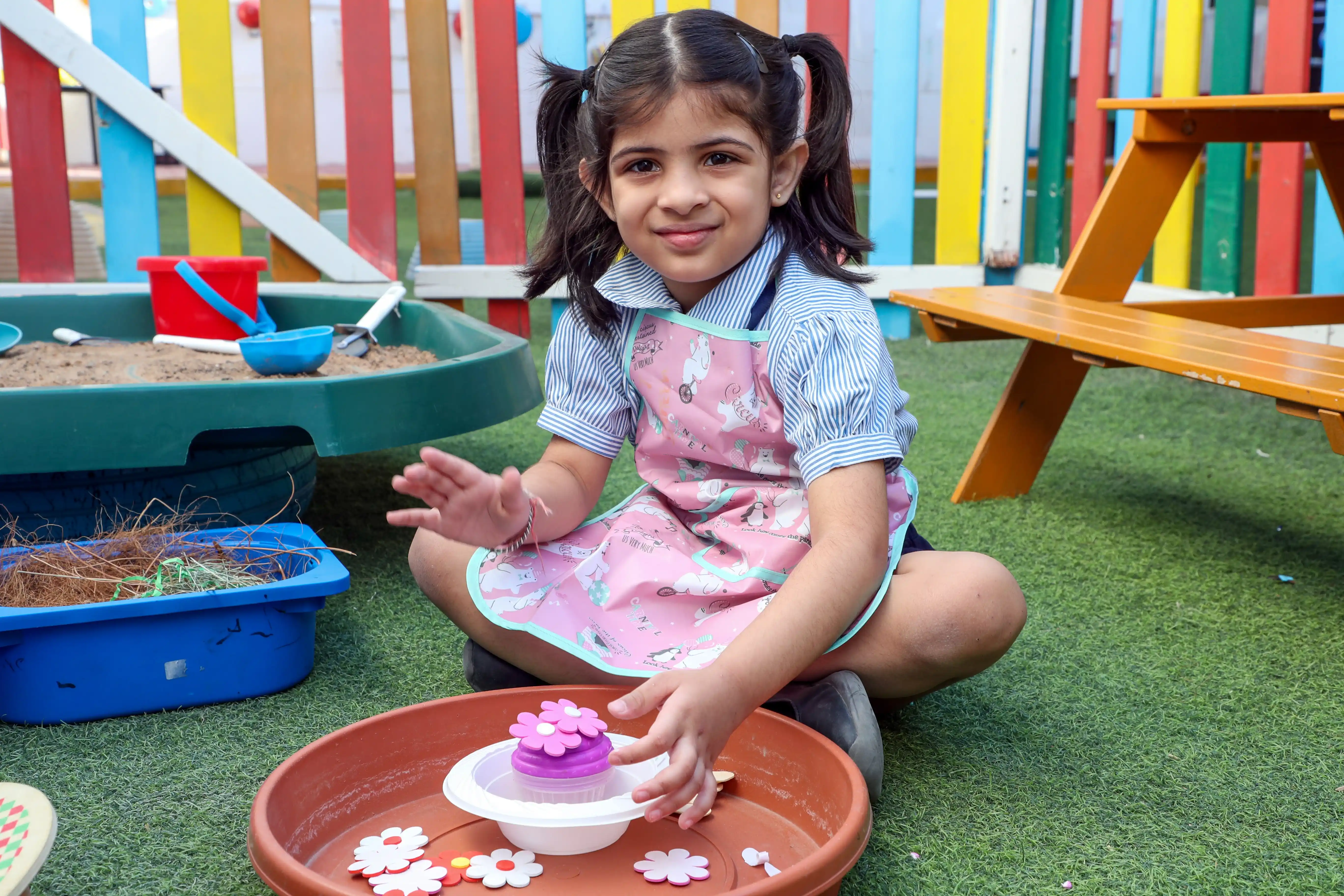 Kid planting flowers