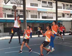 students playing basketball